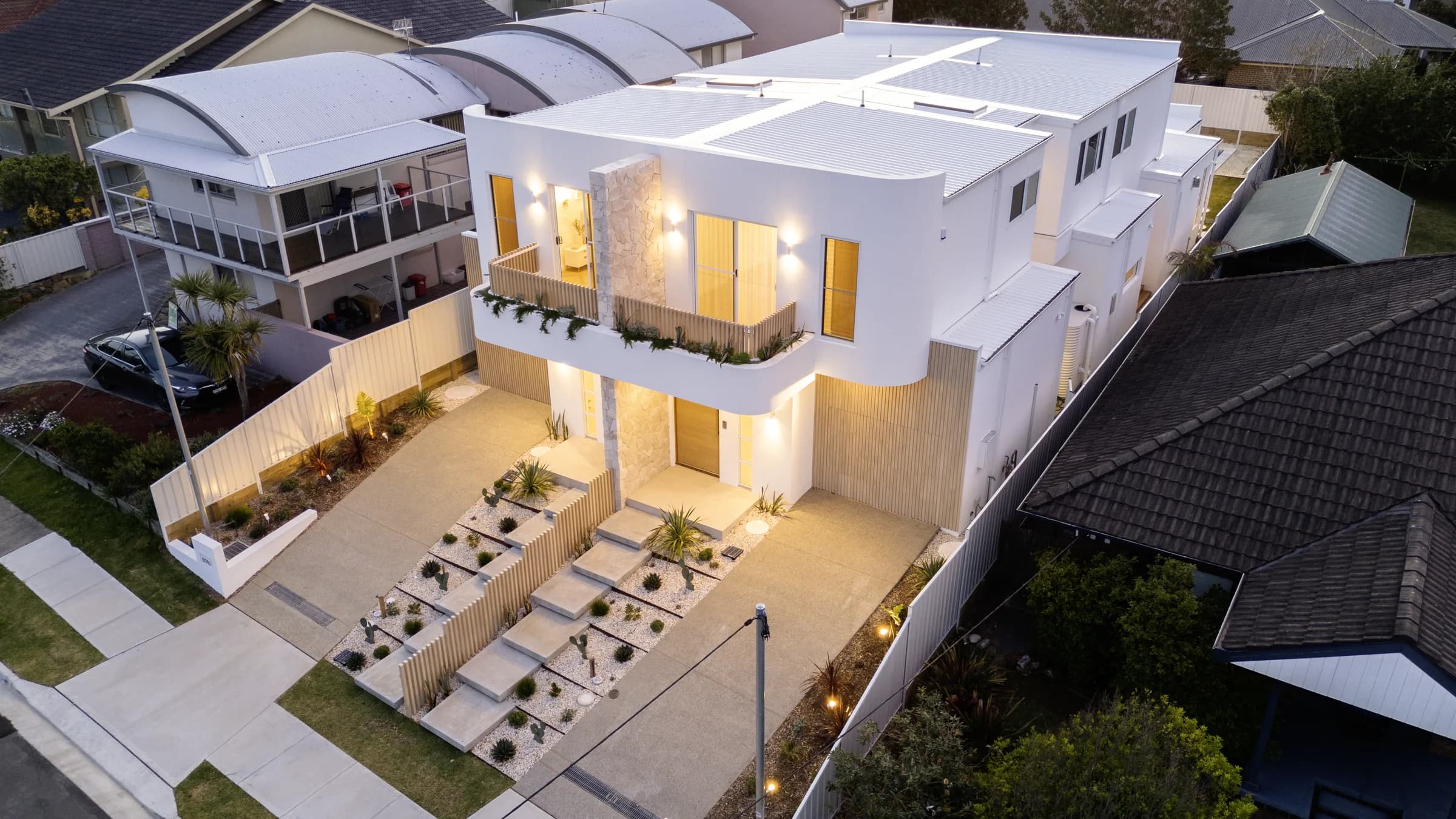 Morris Homes duplex at Blue Bay at dusk, from above