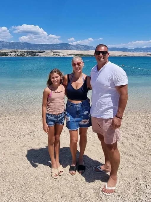 Brad Morris with his family on a beach
