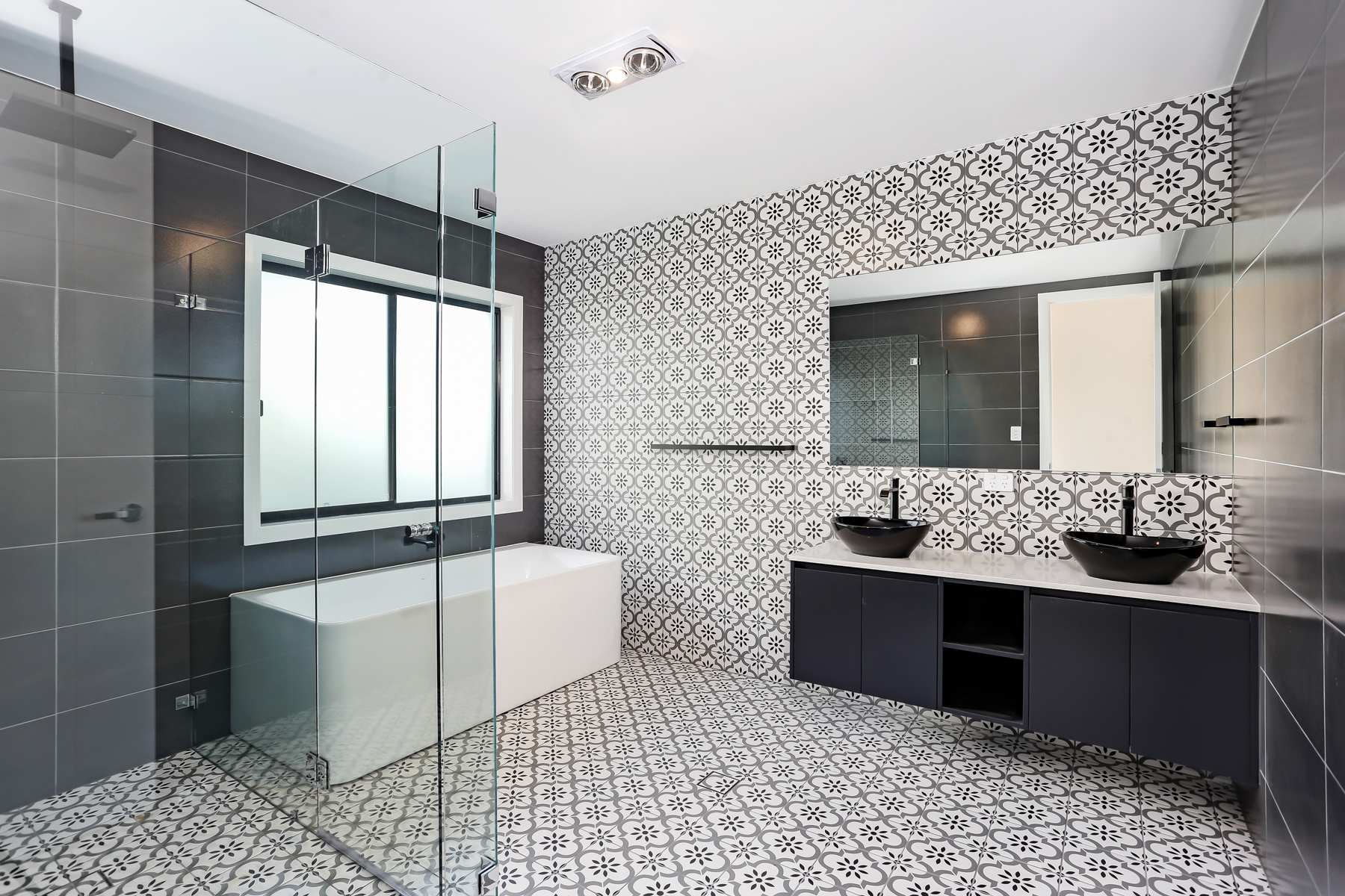 A Bathroom With A Large Glass Shower Door
