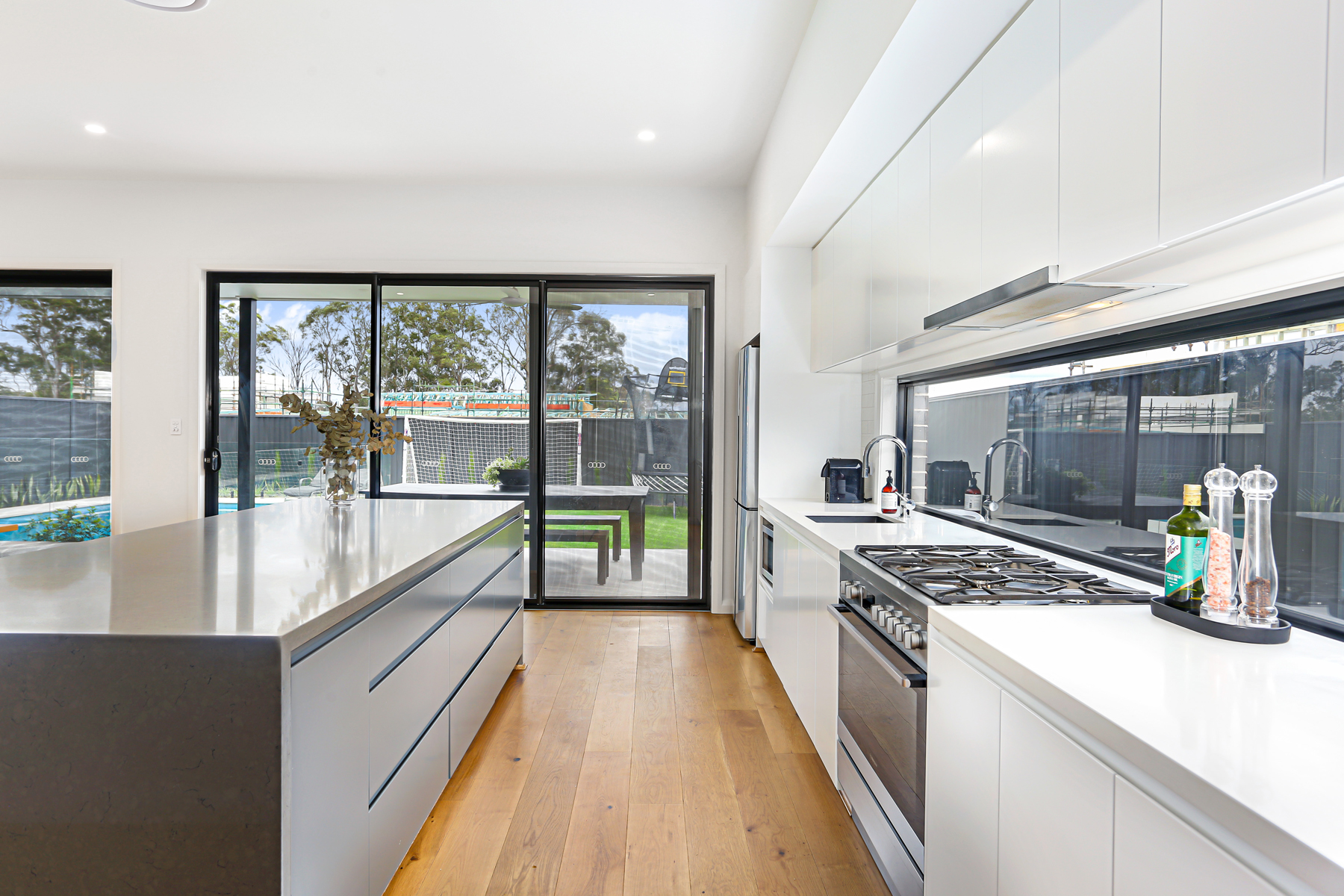 A Modern Kitchen With A Stainless Steel Stove