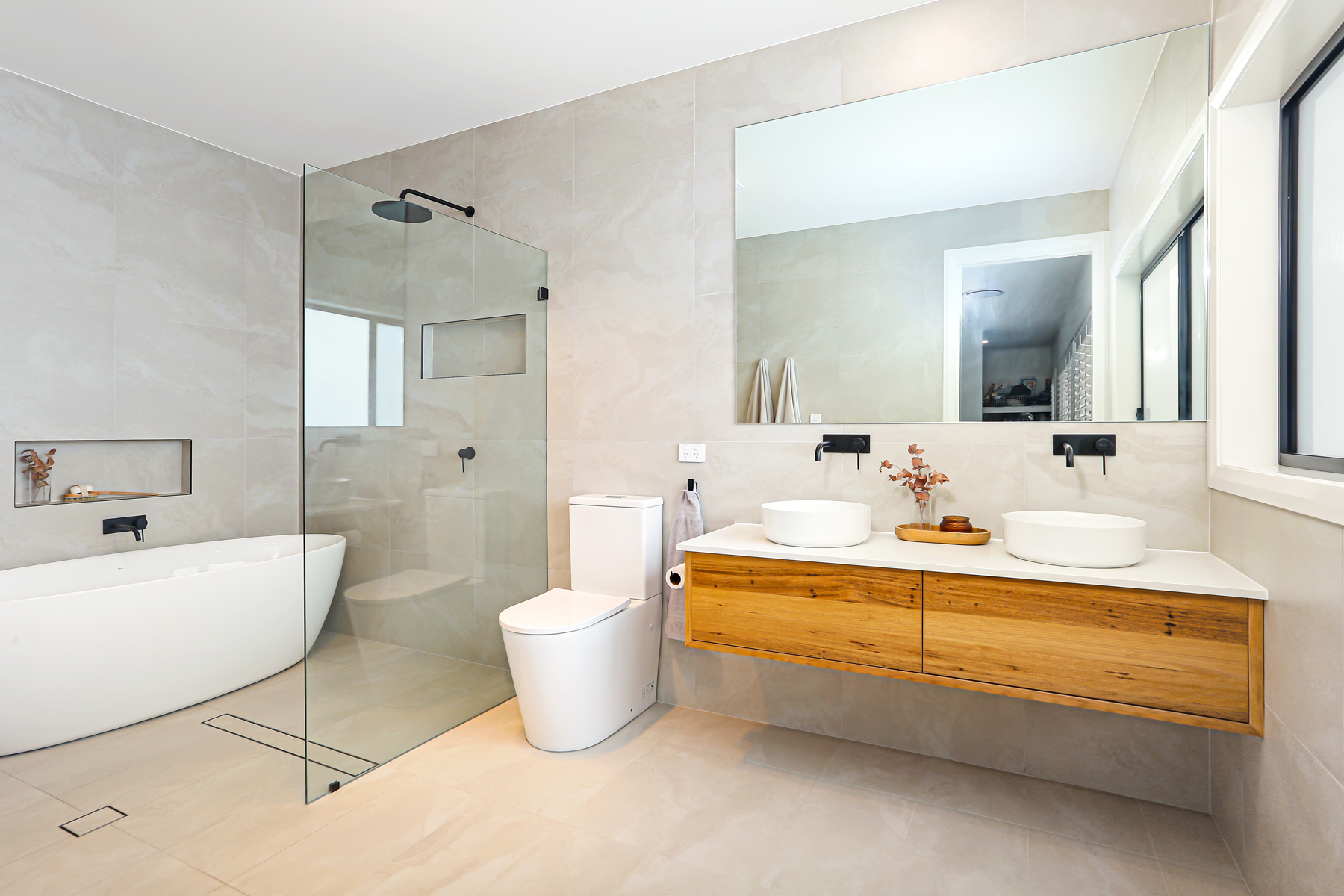 A Bathroom With A Large Glass Shower Door