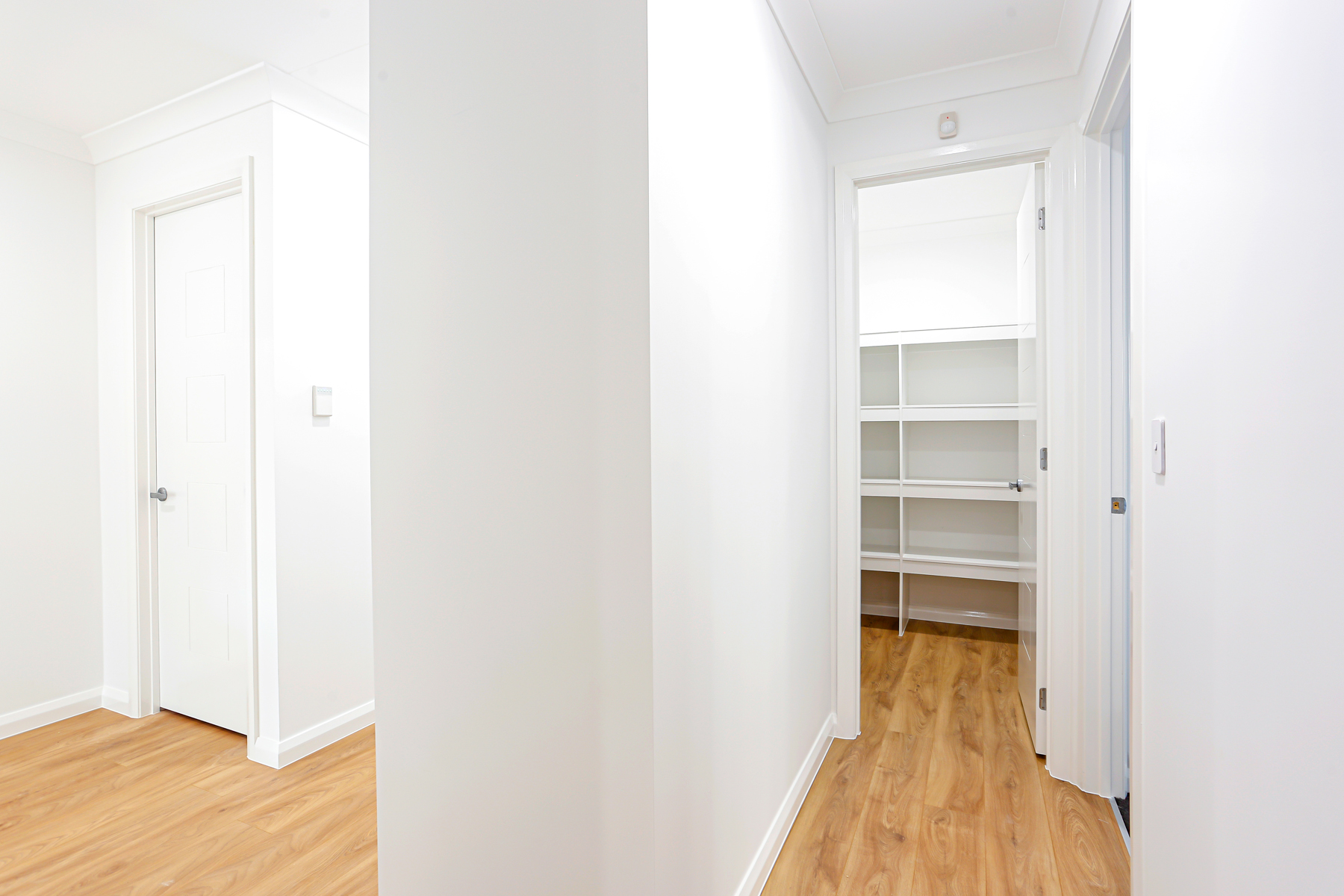 A Hallway With A Closet And A Closet Door