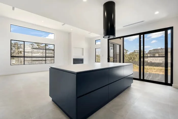 Modern kitchen with dark island,
