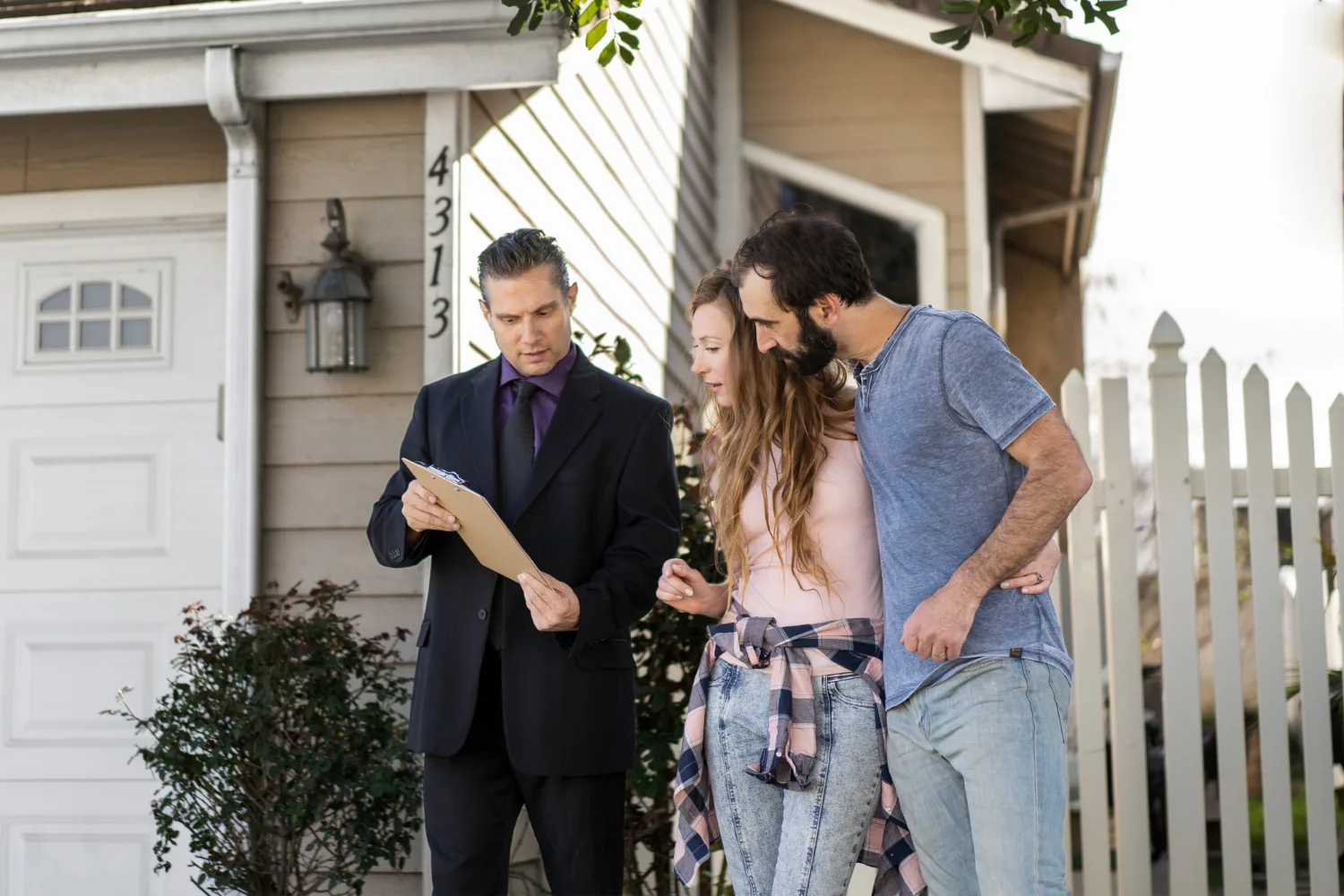 Agent with clipboard talking to a couple