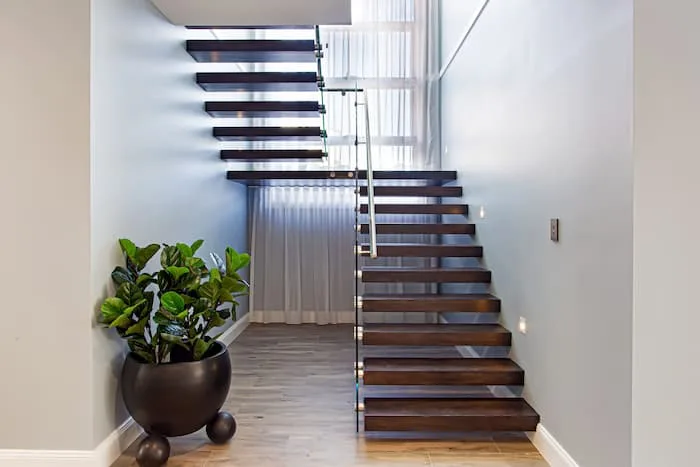 Dark timber floating staircase