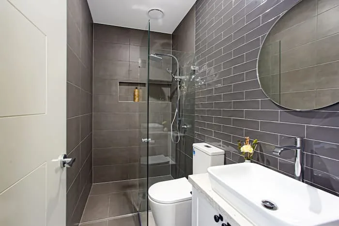 Grey tiled bathroom shower