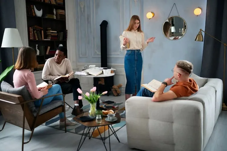 Friends discussing book