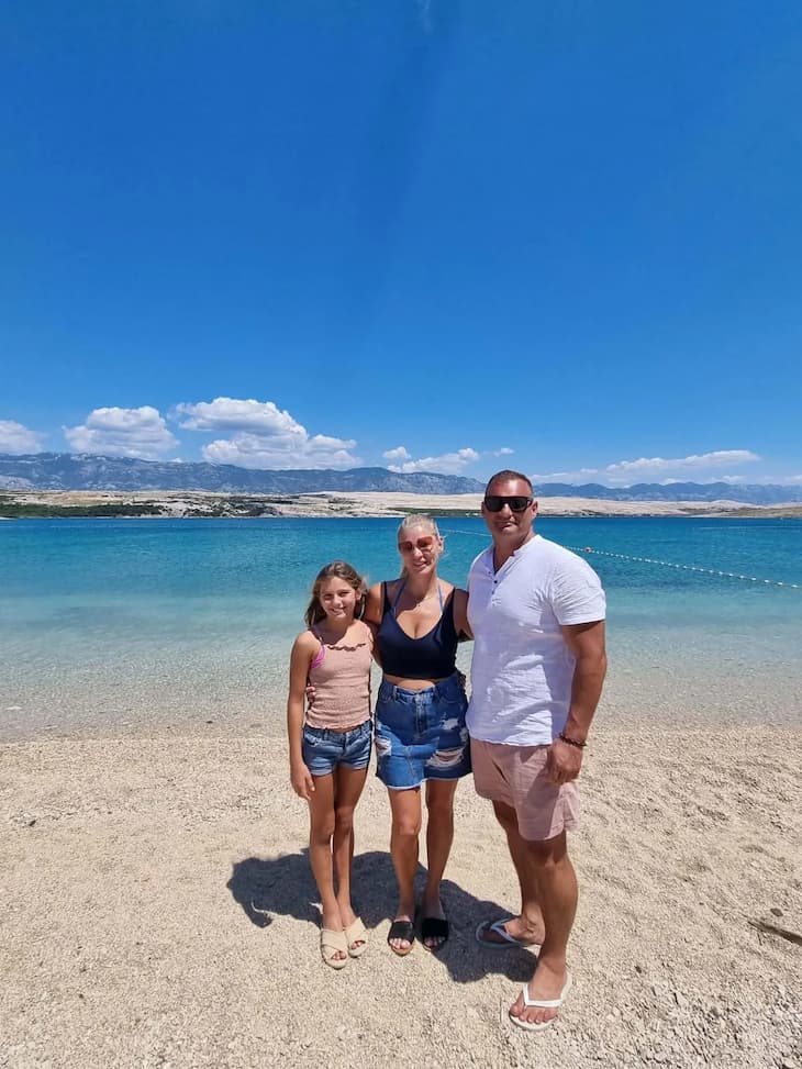 Family posing beach vacation
