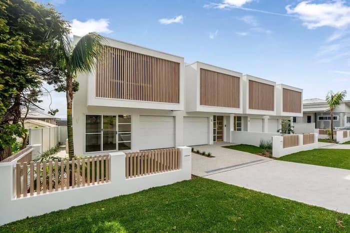 Modern townhouse complex with wood