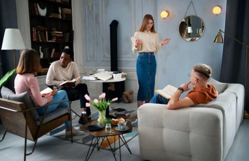Friends discussing book