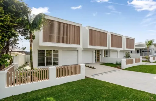 Modern townhouse complex with wood accents and clean design